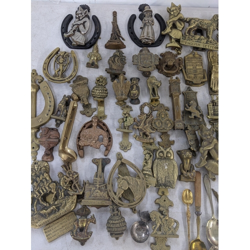 85 - Mixed metalware mostly brass door knockers to include door knockers in the form of gargoyles, one in... 