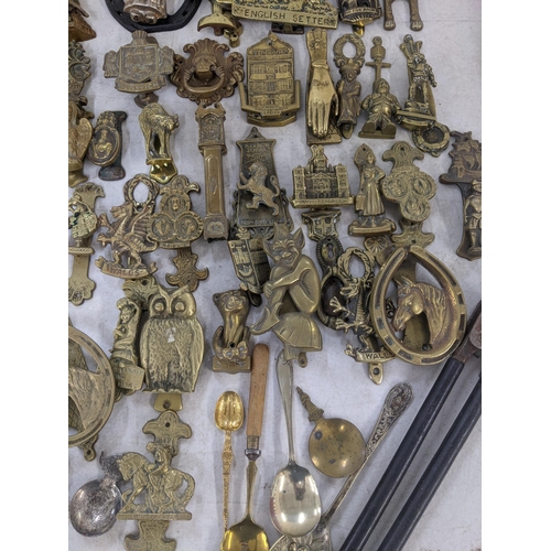 85 - Mixed metalware mostly brass door knockers to include door knockers in the form of gargoyles, one in... 