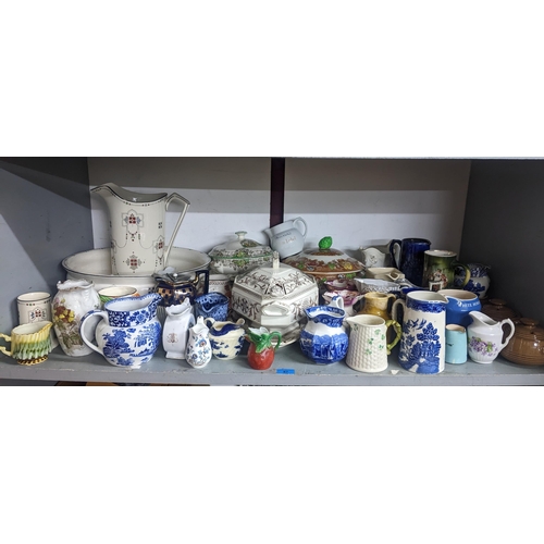 87 - A mixed lot of ceramics to include a collection of jugs, wash jugs set, tureens and other items to i... 