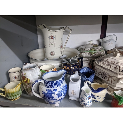 87 - A mixed lot of ceramics to include a collection of jugs, wash jugs set, tureens and other items to i... 