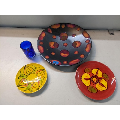 89 - A Poole pottery studio charger, Delphis plate, and Aegeon plate, a West German retro vase, and an Is... 