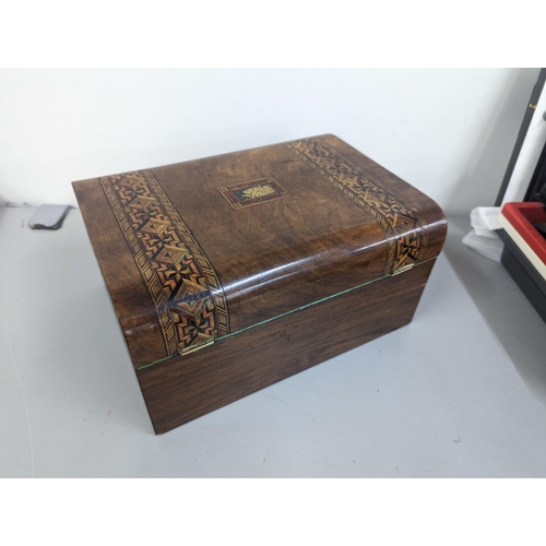 95 - A Victorian walnut sewing box having parquetry inlay
Location:1.1