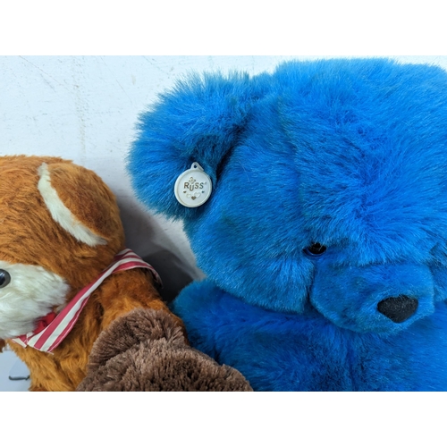 96 - A group of soft toys to include a large vintage Russ blue teddy bear, a D.A.Toys example, Peter Rabb... 