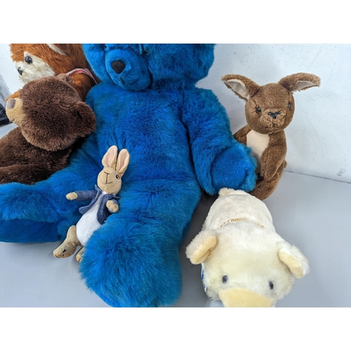 96 - A group of soft toys to include a large vintage Russ blue teddy bear, a D.A.Toys example, Peter Rabb... 