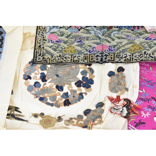 102 - A small collection of Chinese embroidery, comprising a pair of purple silk sleeves embroidered with ... 