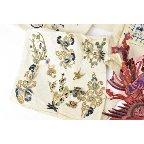 102 - A small collection of Chinese embroidery, comprising a pair of purple silk sleeves embroidered with ... 