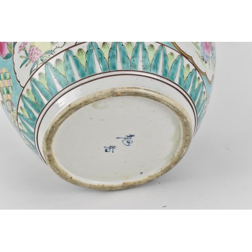 106 - A large Chinese export fish bowl, 20th century, with bats and clouds to the rim above a central cart... 