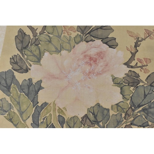 119 - A Chinese watercolour on silk scroll painting of peonies, inscribed and with red seal mark to right ... 