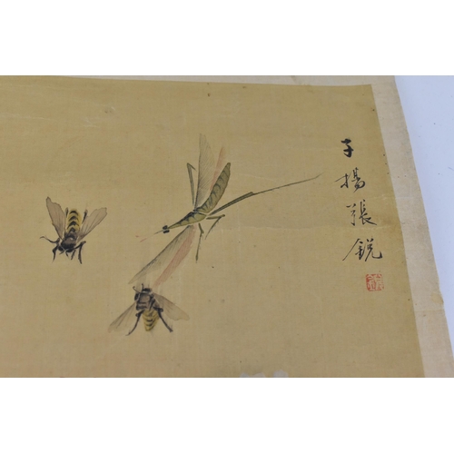 119 - A Chinese watercolour on silk scroll painting of peonies, inscribed and with red seal mark to right ... 