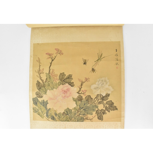 119 - A Chinese watercolour on silk scroll painting of peonies, inscribed and with red seal mark to right ... 