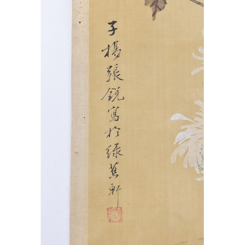 120 - A Chinese watercolour on silk scroll painting of chrysanthemums, inscribed and with red seal mark to... 