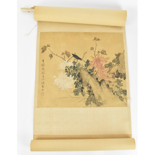 120 - A Chinese watercolour on silk scroll painting of chrysanthemums, inscribed and with red seal mark to... 