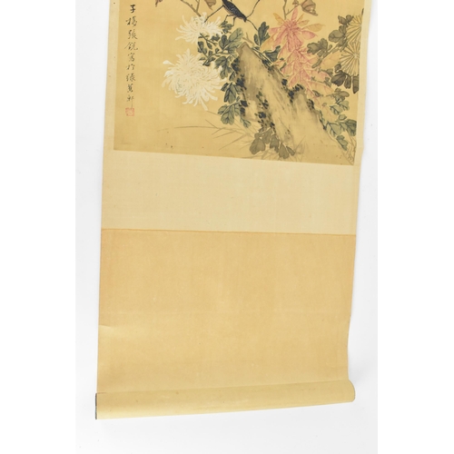 120 - A Chinese watercolour on silk scroll painting of chrysanthemums, inscribed and with red seal mark to... 