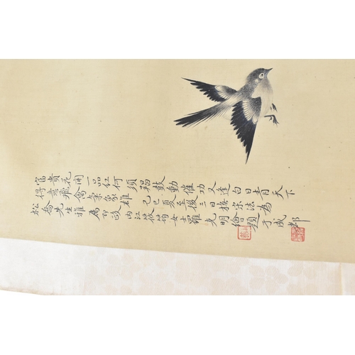 121 - A 20th century Chinese watercolour on silk scroll painting of peonies and bird, inscribed and with r... 