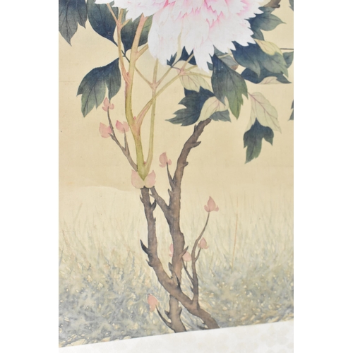 121 - A 20th century Chinese watercolour on silk scroll painting of peonies and bird, inscribed and with r... 