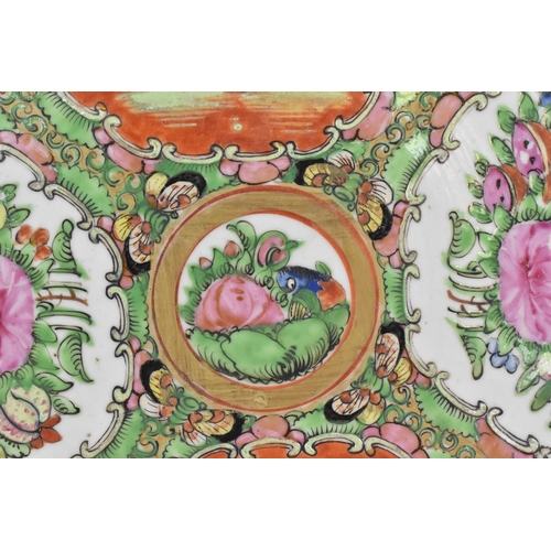 15 - Two Chinese Canton famille rose chargers, mid 19th century, of circular form with fan vignettes depi... 