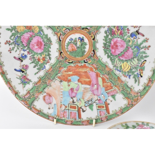 15 - Two Chinese Canton famille rose chargers, mid 19th century, of circular form with fan vignettes depi... 