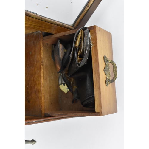 171 - An Edwardian oak smoker's cabinet, with pierced brass gallery to the top front, double moulded borde... 