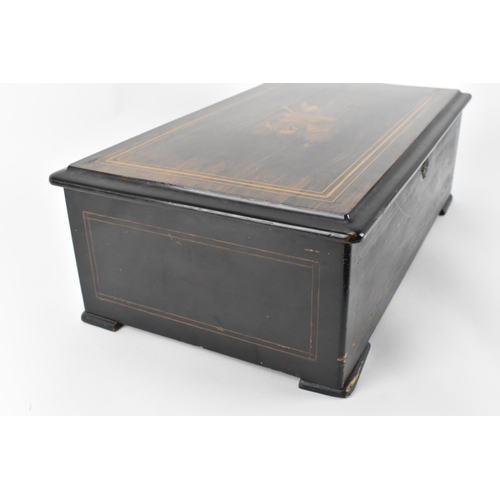 184 - A late 19th/early 20th century Swiss rosewood and inlaid lever wind music box, the top with boxwood ... 