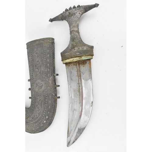 194 - A white metal mounted jambiya and sheath, probably Omani, together with a Peruvian white metal clad ... 