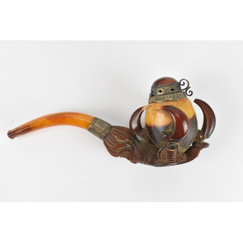 195 - A large Meerschaum pipe carved in the form of a bird’s claw, with silver mounted amber cover and amb... 