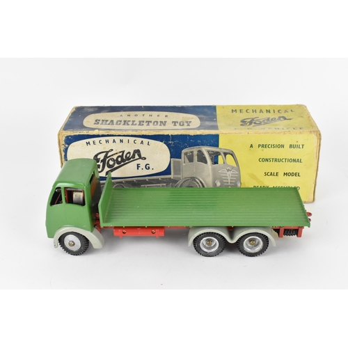 197 - Shackleton tin plate FG Foden clockwork flatbed truck, with green cab and green back, grey mud guard... 