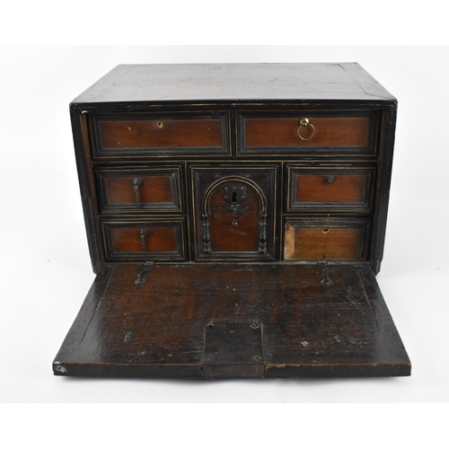 201 - An early 19th century mahogany and ebonised wood travel cabinet, with bone inlaid stringing to the t... 