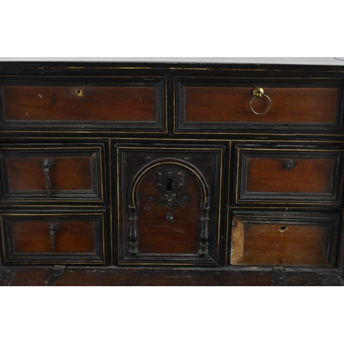 201 - An early 19th century mahogany and ebonised wood travel cabinet, with bone inlaid stringing to the t... 