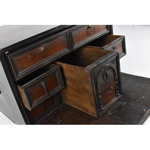 201 - An early 19th century mahogany and ebonised wood travel cabinet, with bone inlaid stringing to the t... 