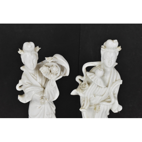 67 - Two Chinese Blanc-de-Chine figures of Guanyin, Dehua, early 20th century,  modelled standing raised ... 