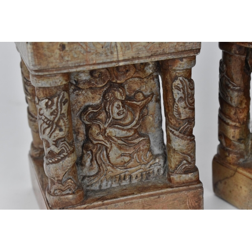 69 - A pair of carved soapstone models of temple guardian Foo dogs, each modelled with a large dog and sm... 