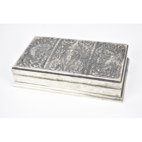 72 - A South East Asian sterling silver cigarette box, late 19th/early 20th century, designed with three ... 