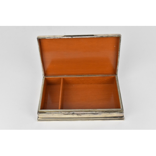 72 - A South East Asian sterling silver cigarette box, late 19th/early 20th century, designed with three ... 