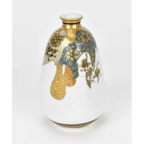 76 - A small Japanese Kutani porcelain bud vase, Meiji period, designed with various shaped patterns with... 