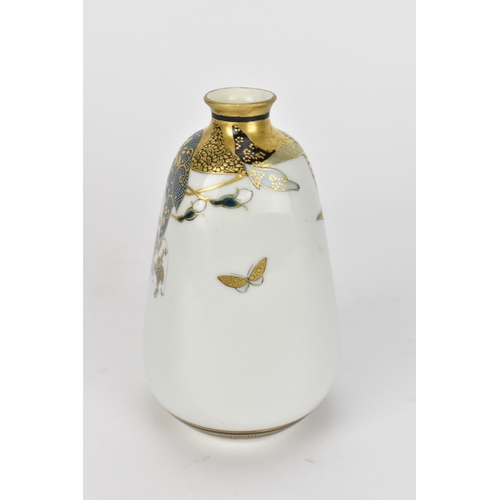 76 - A small Japanese Kutani porcelain bud vase, Meiji period, designed with various shaped patterns with... 