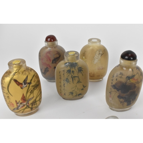 79 - A collection of Chinese snuff bottles and porcelain, comprising six reverse glass painted snuff bott... 