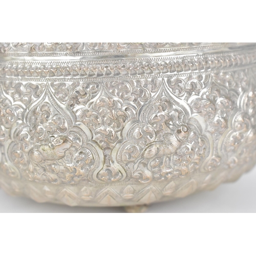 83 - An Indian colonial export white metal cutch bowl, of circular form with profusely embossed foliage, ... 