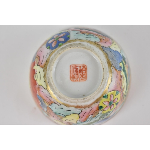 94 - A Chinese late Qing dynasty famille rose Buddhist lions bowl, 19th century, the lions playing with b... 