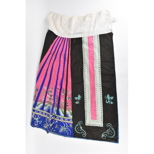 97 - A Chinese Han embroidered silk qun/skirt, late 19th/early 20th century, in pink, blue and black, wit... 