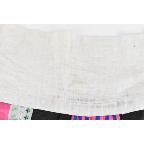 97 - A Chinese Han embroidered silk qun/skirt, late 19th/early 20th century, in pink, blue and black, wit... 