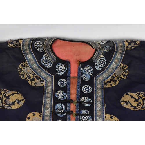 98 - A Chinese Qing dynasty embroidered silk jacket, in navy with gilt roundels and floral details to the... 