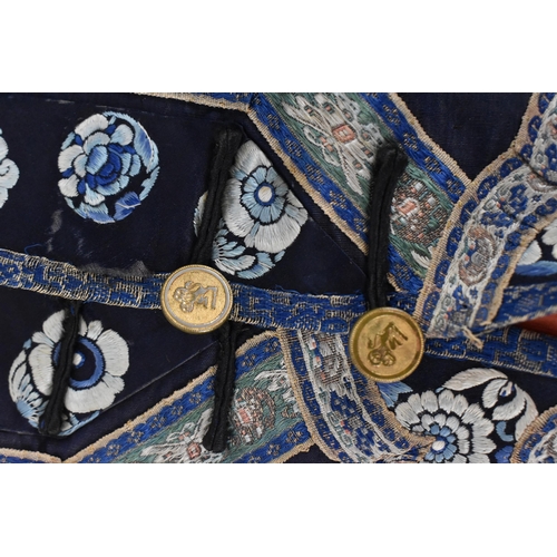 98 - A Chinese Qing dynasty embroidered silk jacket, in navy with gilt roundels and floral details to the... 