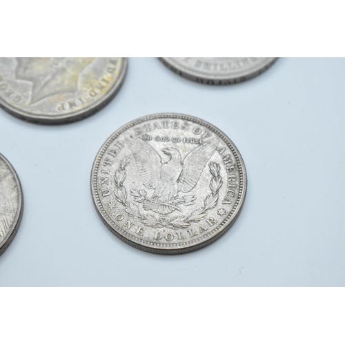 152 - A group of mixed British and American coinage to include a 1821 crown 1921 Morgan Dollar, a pair of ... 