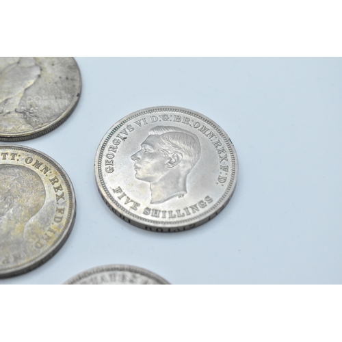 152 - A group of mixed British and American coinage to include a 1821 crown 1921 Morgan Dollar, a pair of ... 