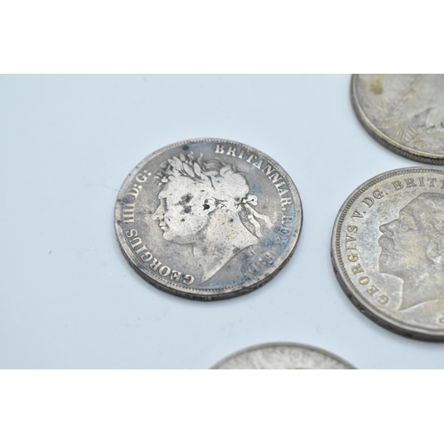 152 - A group of mixed British and American coinage to include a 1821 crown 1921 Morgan Dollar, a pair of ... 