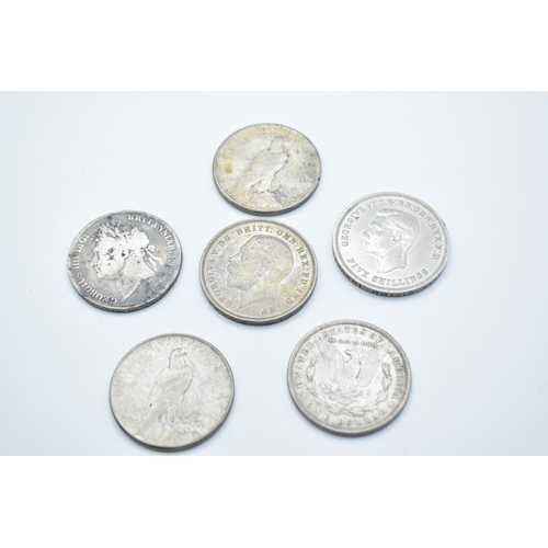 152 - A group of mixed British and American coinage to include a 1821 crown 1921 Morgan Dollar, a pair of ... 