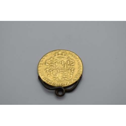 169 - United Kingdom - George III (1760-1820) Guinea date worn possibly 1777, having a later mount attache... 