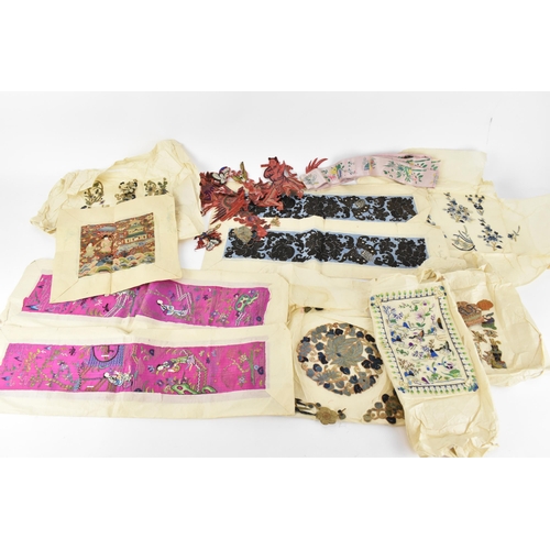 102 - A small collection of Chinese embroidery, comprising a pair of purple silk sleeves embroidered with ... 