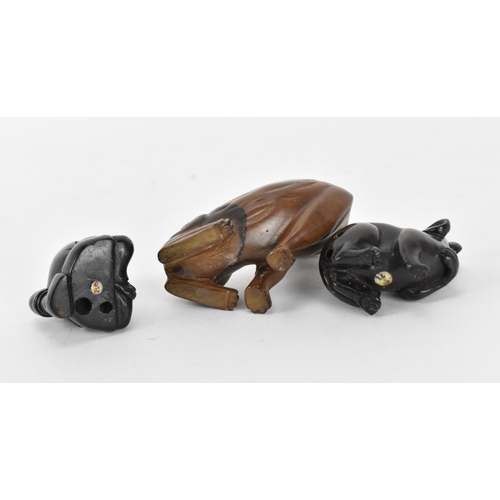 125 - Three Japanese carved wood netsukes, comprising a model of a rat, a tiger and a seated figure, the r... 