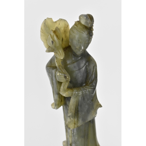 127 - Two Chinese spinach jade figural sculptures, modelled as two of the eight immortals, He Xian Gu and ... 